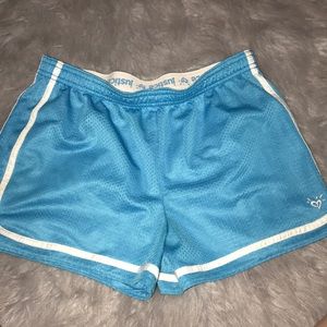 Blue justice shorts and black justice shorts